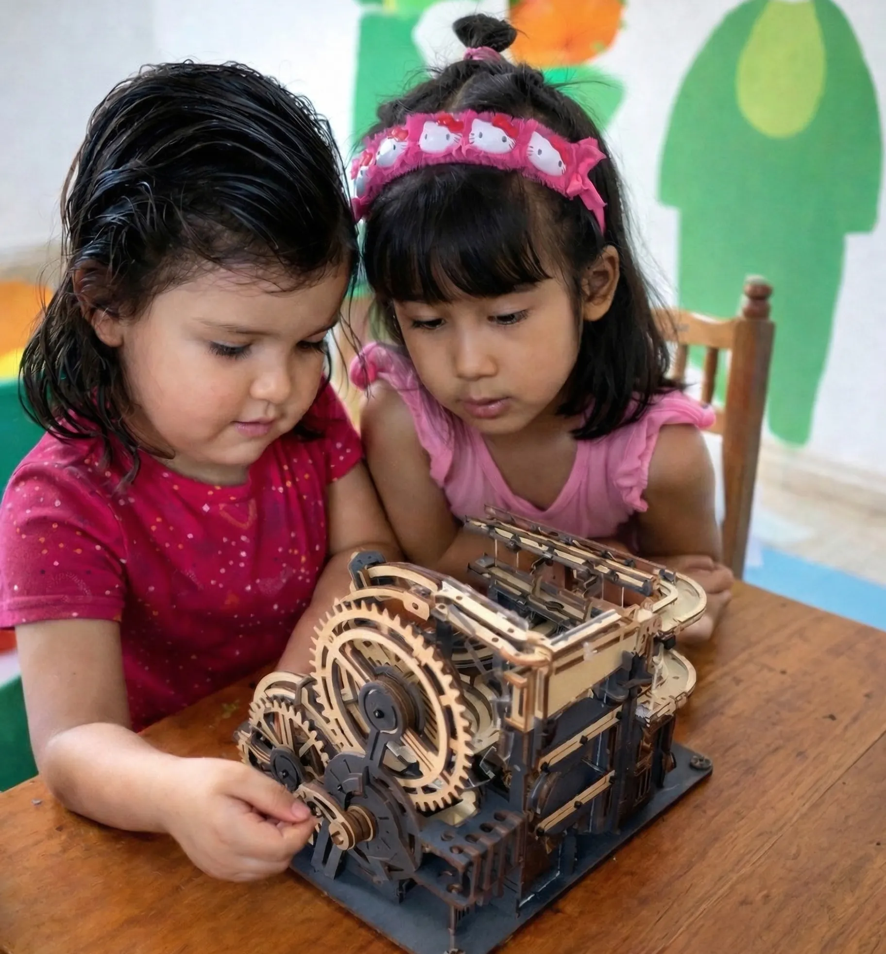 Girl playing with a machine at Colossal Academy Primary